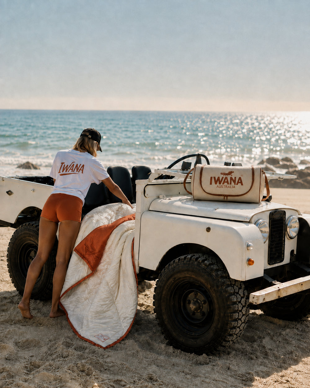 IWANA Early Check-In outdoor blanket and carry bag on a 4WD at the beach